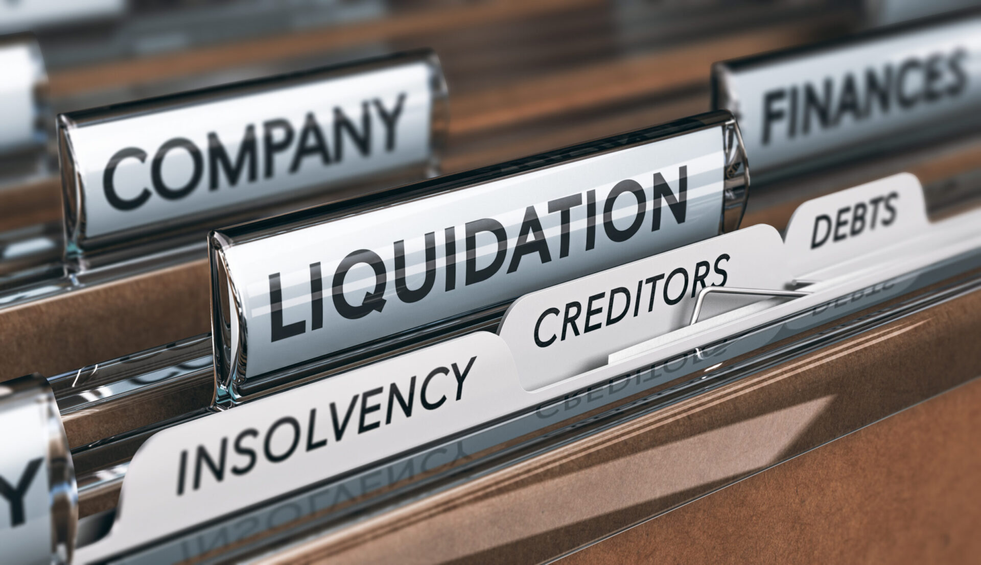 File cabinet and tabs with the words insolvency, creditors and debts